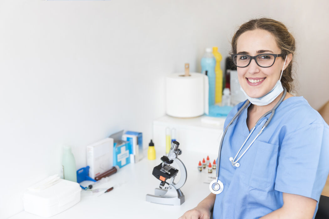 Portrait smiling female doctor laboratory